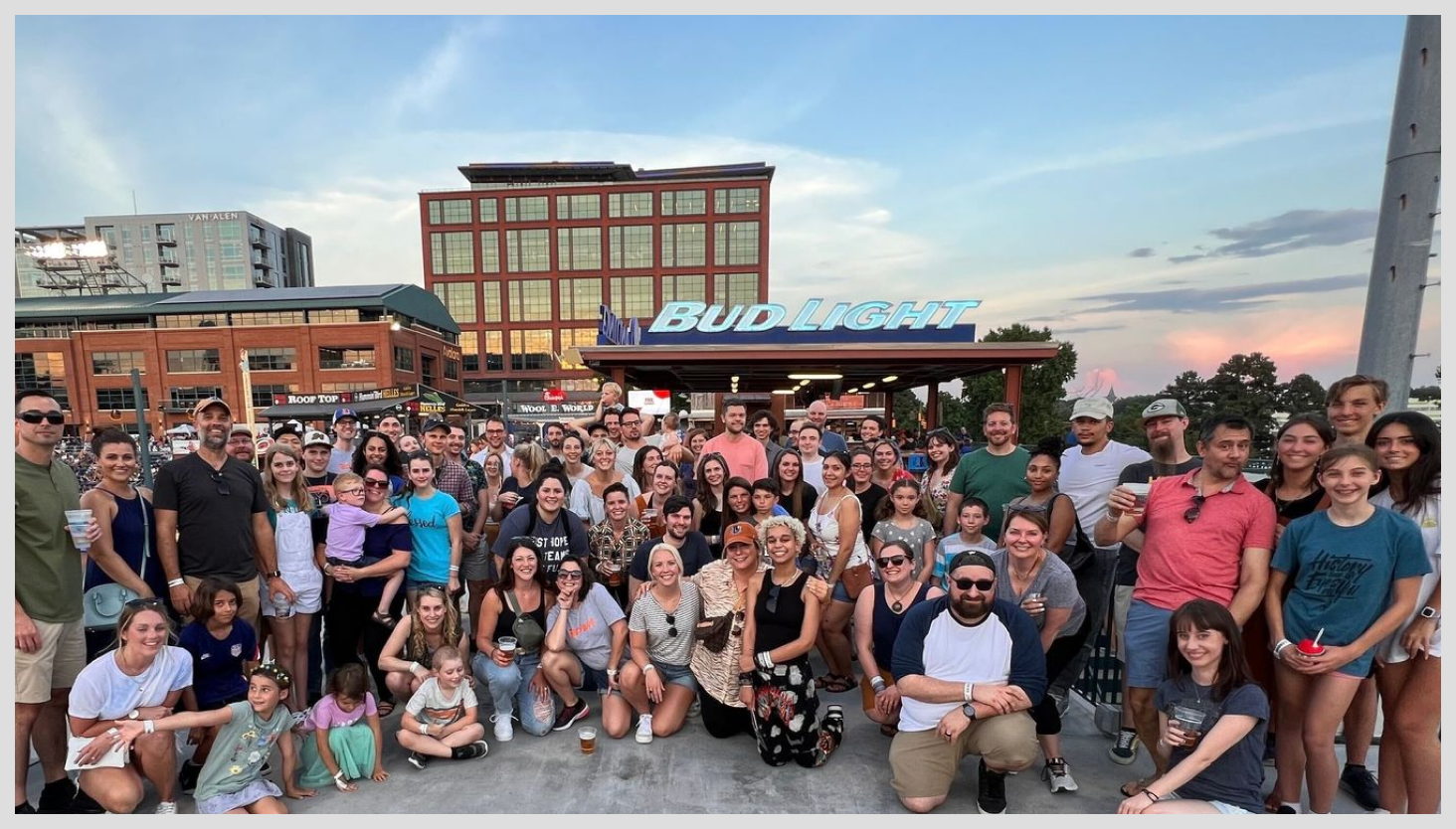 RevBoss team members in front of a Bud Light stand